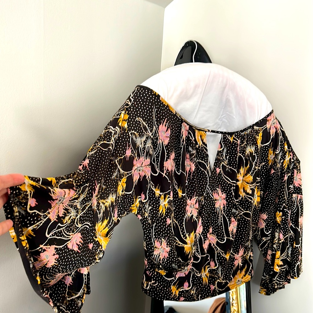 Free People black blouse with floral pink , yellow and beige colors